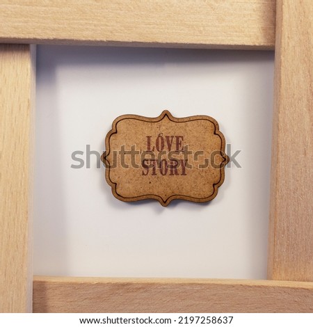 Love story was written on wooden surface. Wooden concept. Celebrations and special occasions