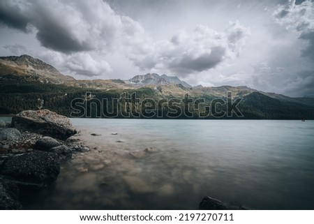 Great view of the rocky massif. Popular tourist attraction. Dramatic and picturesque scene. Location Lake Silvaplana in Swiss alps, Engadin valley, Switzerland, Europe. Beauty world. Long Exposure.