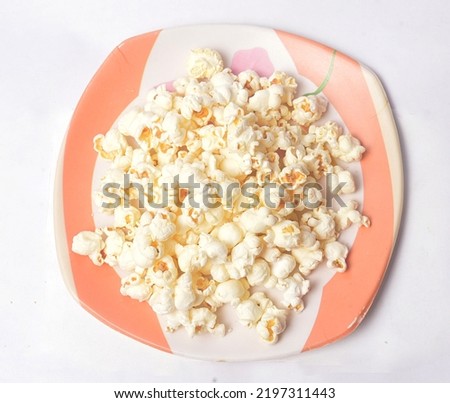 Tasty Spicy Homemade Popcorn on White Background