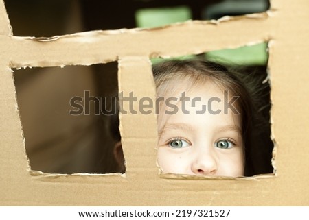 girl in a booth from a cardboard box Royalty-Free Stock Photo #2197321527