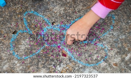 children's drawing with crayons on asphalt
