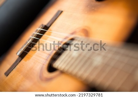 detail of classic guitar with shallow depth of field
