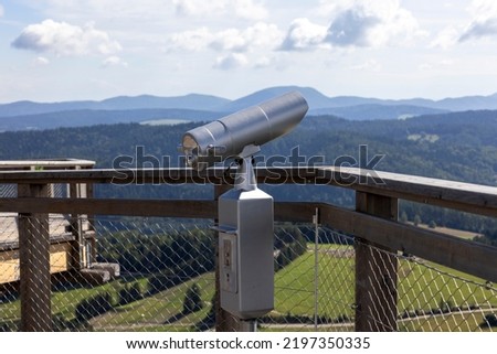 Telescope on the observation tower  at the top of the Słotwiny Arena ski station, leading in the treetops, beautiful panorama of the mountain peaks, Krynica Zdroj, Beskid Mountains, Slotwiny, Poland  Royalty-Free Stock Photo #2197350335
