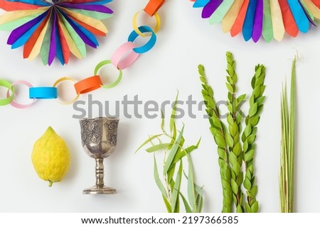 Jewish holiday Sukkot traditional symbols and decorations isolated on white background. Top view, flat lay Royalty-Free Stock Photo #2197366585