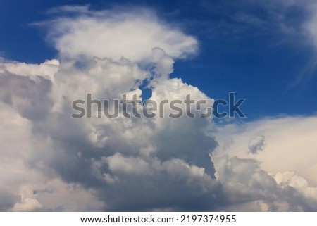 Autumn cloudy dramatic rainy sky background. Panoramic view with beautiful clouds. Horizontal cloudscape. High-resolution photography. Design element. Selective focus. Copy space. 