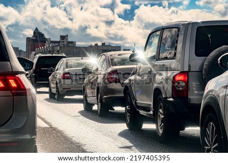 Background, blur, out of focus, bokeh. Traffic jams during rush hours after work. Red brake lights of stopped cars on the background of the city neighborhood