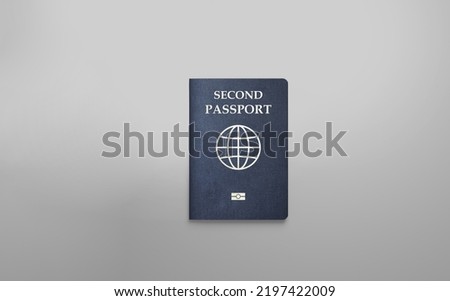Second passport on a white background Royalty-Free Stock Photo #2197422009