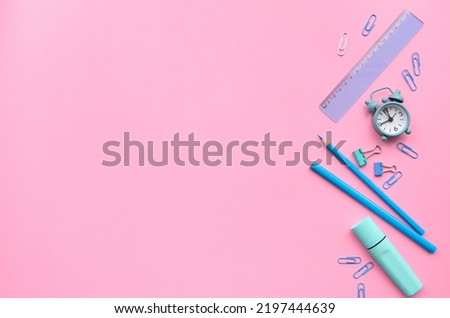 Stationery school supplies products accessories isolated on pastel pink background, trendy flatlay, top view. Stationary accessories stuff for education. Back to school time concept.
