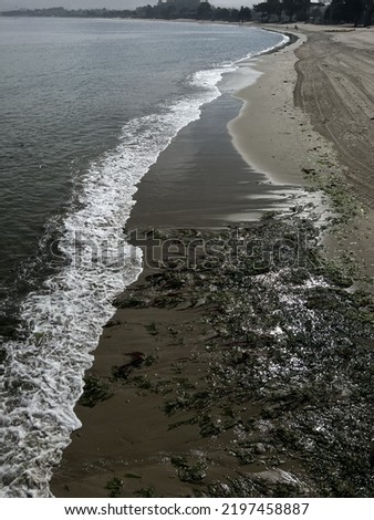 Water waves on San beach in diminishing perspective