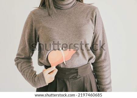 woman with liver pain, hepatitis vaccination, liver cancer treatment, world hepatitis day Royalty-Free Stock Photo #2197460685