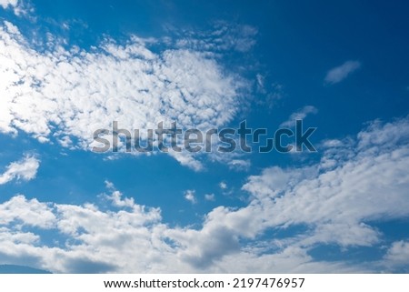 White clouds blue sky background.