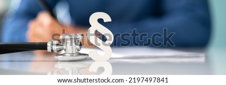 Medical Doctor Malpractice. Paragraph And Stethoscope In Law Court Royalty-Free Stock Photo #2197497841