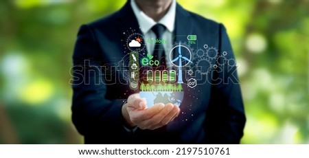 Carbon neutrality net zero. The hand of pollution and effective management with netzero symbols - renewable energy, reduced CO2 emissions, green production, and waste recycling with regard to business Royalty-Free Stock Photo #2197510761