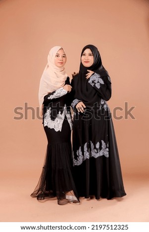 Beautiful Asian women in hijab over isolated background. Fashion design in south east asian.