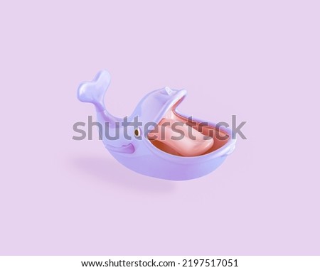 Vibrant, purple cheerful child's toy whale with heart shaped tail, big open mouth and tongue on isolated pastel purple-pink background. Concept of carefree childhood, fairy tales or imagination.