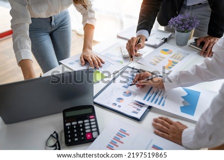 business people meeting in the office Calculate the tax and income of the company's investment. Strategic Planning and Brainstorming colleague concept, report, analyze graph plans 