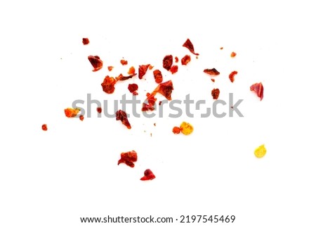 Dried chili flakes and seeds isolated on white background, top view. Red pepper isolated on white background, top view. Pieces of red pepper isolated on white background, top view. Royalty-Free Stock Photo #2197545469