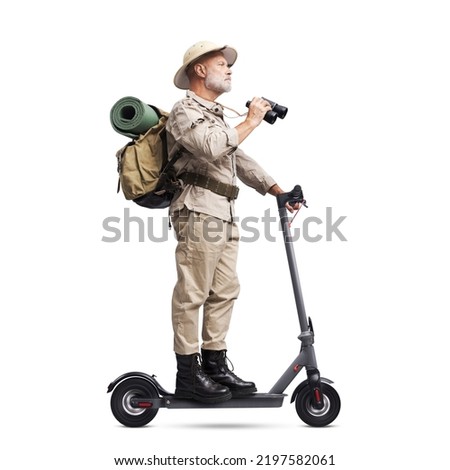 Funny explorer riding a fast electric scooter and holding binoculars, isolated on white background