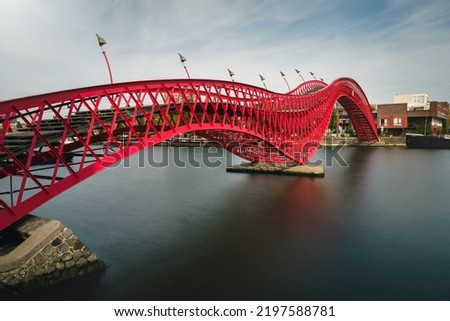 Python Bridge, officially known as High Bridge (Hoge Brug), is a bridge that spans the canal between Sporenburg and Borneo Island in Eastern Docklands, Amsterdam - the Netherlands Royalty-Free Stock Photo #2197588781