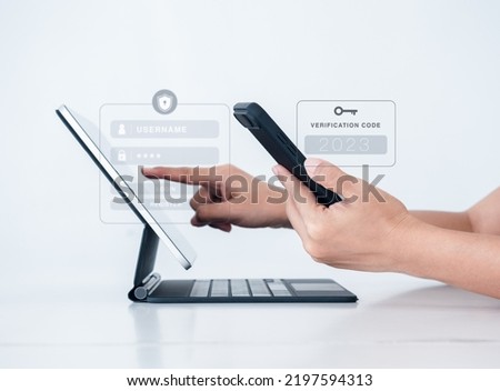 Two steps authentication or 2FA concept. 2023 Verification code with key icon on smart phone screen in hand with laptop for validate password page, Identity verification, cyber security technology. Royalty-Free Stock Photo #2197594313