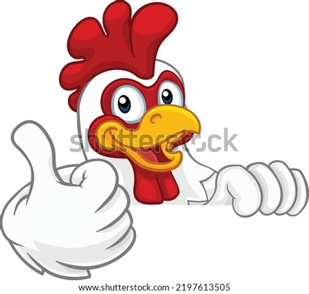 A chicken rooster cockerel bird cartoon character peeking over a sign and giving a thumbs up Royalty-Free Stock Photo #2197613505