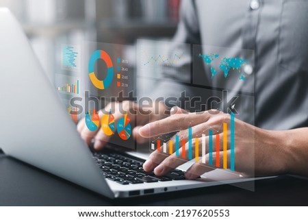 Businessman analyzing company's financial balance sheet working with digital augmented reality graphics. Businessman calculates financial data for long-term investment.