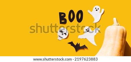Halloween set decorations with ghost, bat, pumpkin, skeleton and word BOO on yellow background. Holiday party, minimal greeting card, spooky concept. flat lay, copy space, top view, place for text