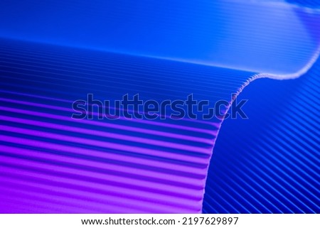 Pink and blue illuminated corrugated shapes. Geometric abstract background. Royalty-Free Stock Photo #2197629897
