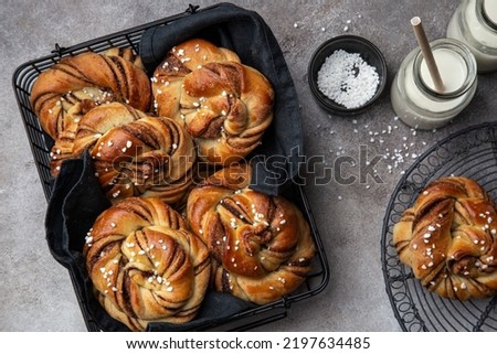 Kanelbullar, swedish cinnamon and cardamon buns, top view Royalty-Free Stock Photo #2197634485