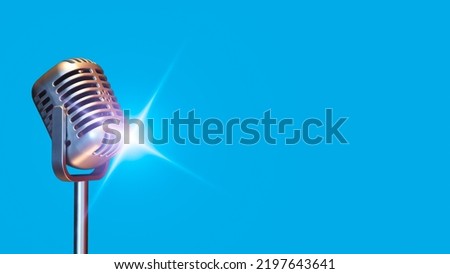 retro condenser microphone with  flare light, isolated on blue. music background