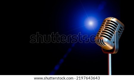 retro condenser microphone with  flare light, isolated on black. music background
