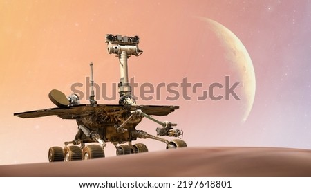 Mars Rover on red planet. Martian expedition. Perseverance, Curiosity, Opportunity Mars Exploration Rover. Elements of this image furnished by NASA Royalty-Free Stock Photo #2197648801