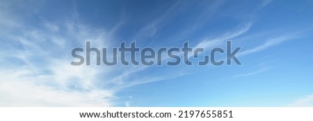 Ornamental clouds. Dramatic sky. Epic storm cloudscape. Soft sunlight. Panoramic image, texture, background, graphic resources, design, copy space. Meteorology, heaven, hope, peace concept Royalty-Free Stock Photo #2197655851