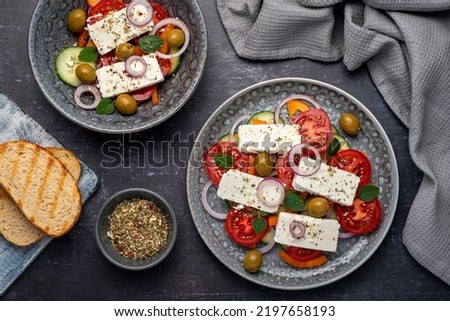 Food photography of greek salad, feta, cucumber, onion, tomato,  olive