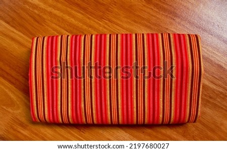 Striped Pattern "Buton Sarong" from Buton Island, Indonesia. Buton Sarong is a type of traditional woven fabric that is only produced by the craftsmen and using a hand-tool not a machine