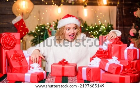 Happy woman and bunch of gifts boxes. Beautiful wrapped gifts. Xmas concept. Festive mood. Gift shop. December happy moments. Girl ready for celebration. Gifts integral part of new year celebration