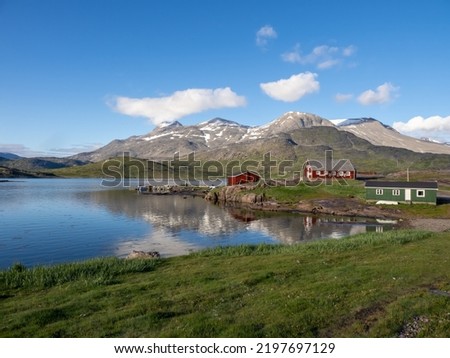 View of Igaliku in southern Greenland. A settlement with just a few dozen inhabitants. Famous for its Norse ruins of Garðar and its unique farming sites at the edge of the ice cap. Royalty-Free Stock Photo #2197697129