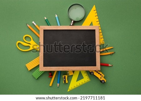 Education equipment on the green background poster. Creative hand craft. Happy world teachers day. 