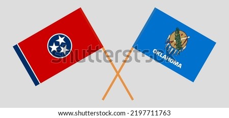 Crossed flags of The State of Tennessee and The State of Oklahoma. Official colors. Correct proportion. Vector illustration
