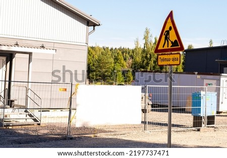 Construction site and road sign "Construction in progress", in Finland.