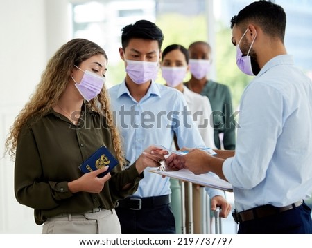 Covid passport, airport travel restrictions and ticket id at security queue border for immigration traveler. Compliance officer checking passenger safety info, transport document and risk certificate Royalty-Free Stock Photo #2197737797