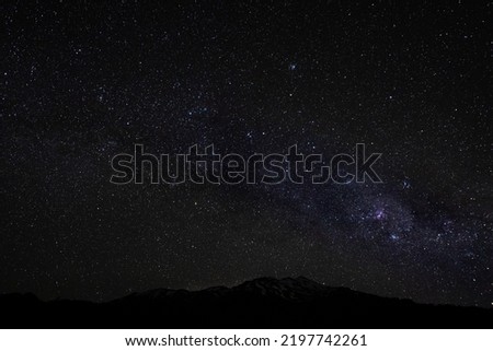 a southern night sky photo showing the tail of the milky way on a beautiful clear night