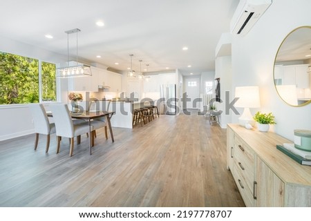 dining room with set table large windows with green trees wood floors clean and bright white Royalty-Free Stock Photo #2197778707