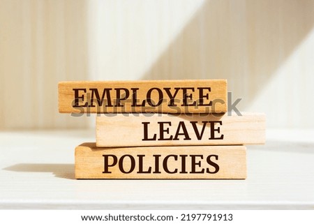Wooden blocks with words 'Employee Leave Policies'. Royalty-Free Stock Photo #2197791913