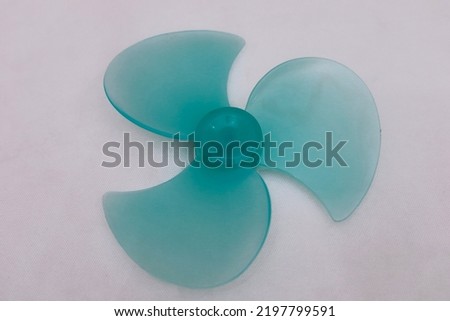 Three blade plastic fan blades.  table fan isolated on a white background