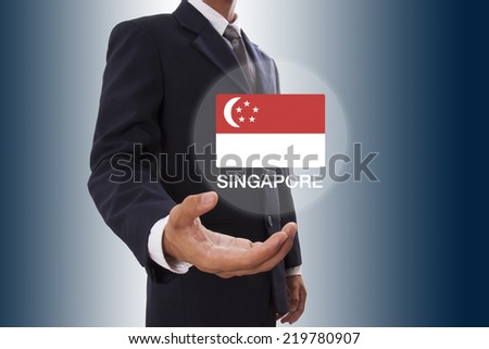 Businessman hand showing Singapore Flag 