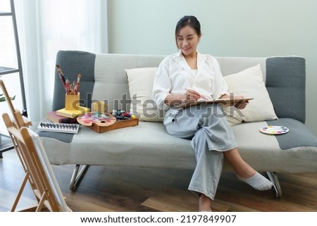 Portrait of an Asian woman designing art in her spare time