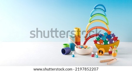 Wooden educational toys for preschool children on a blue background. Montessori method. Copy space. Royalty-Free Stock Photo #2197852207