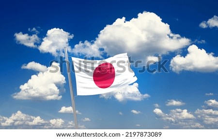 Japan national flag waving in beautiful clouds.