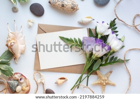 card mockup with shells and eustomas, white flowers, sea theme